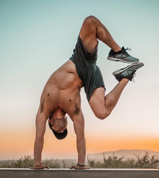 yogarebel man hanstand.jpg